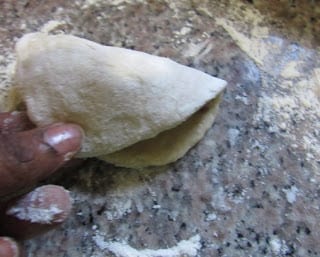 ROLLING DOUGH TO FRY